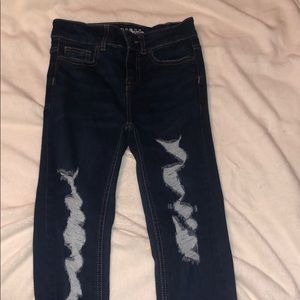 Dark distressed skinny jeans